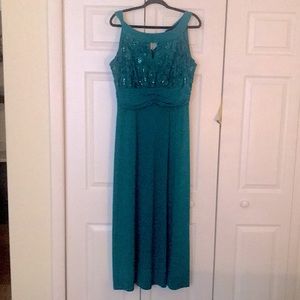 Long green dress with sequined roses on top front